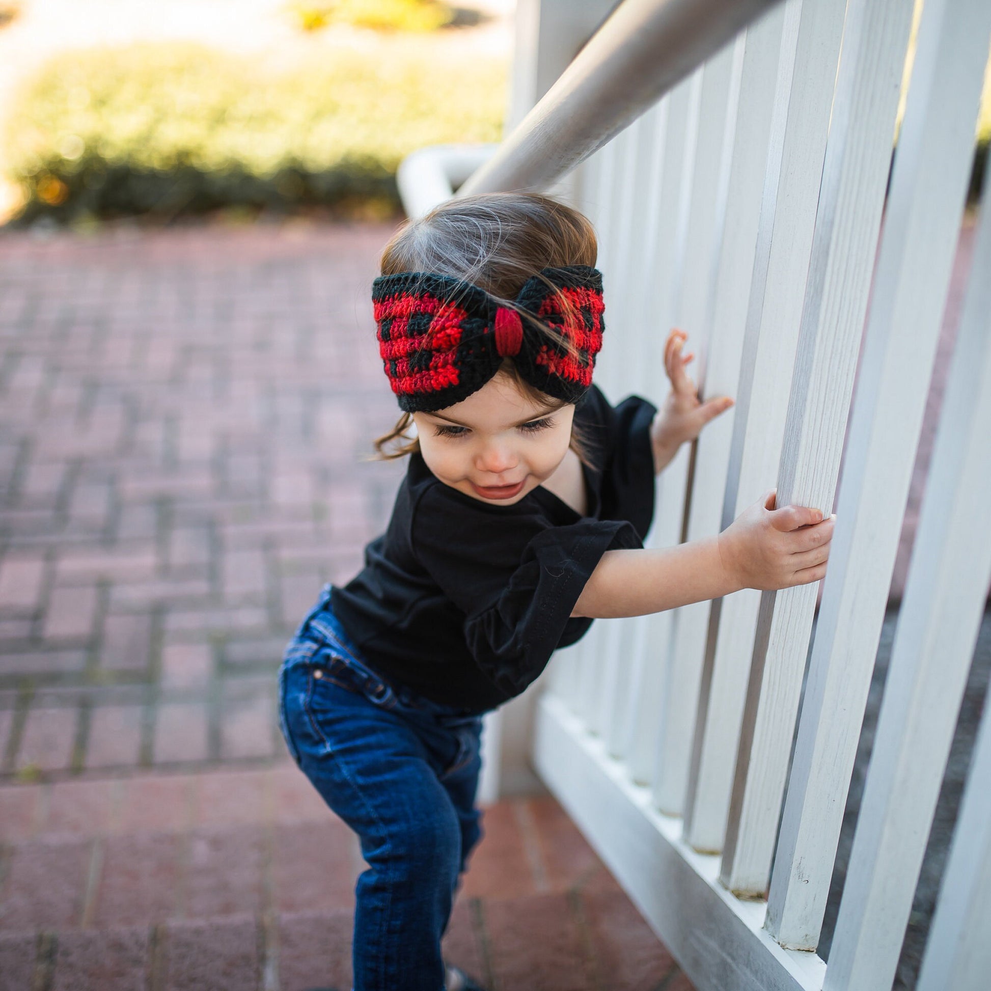 head on view of a buffalo plaid ear warmer headband