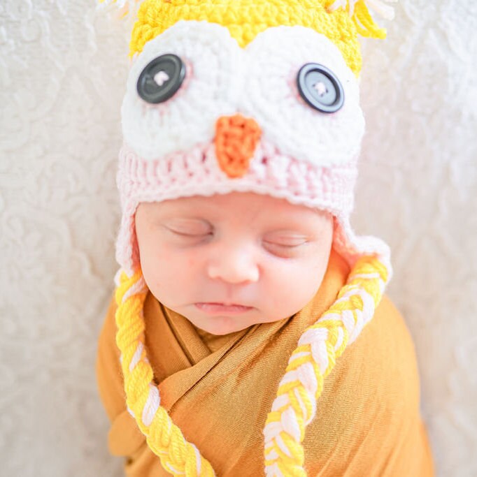 close up of the face of the owl beanie