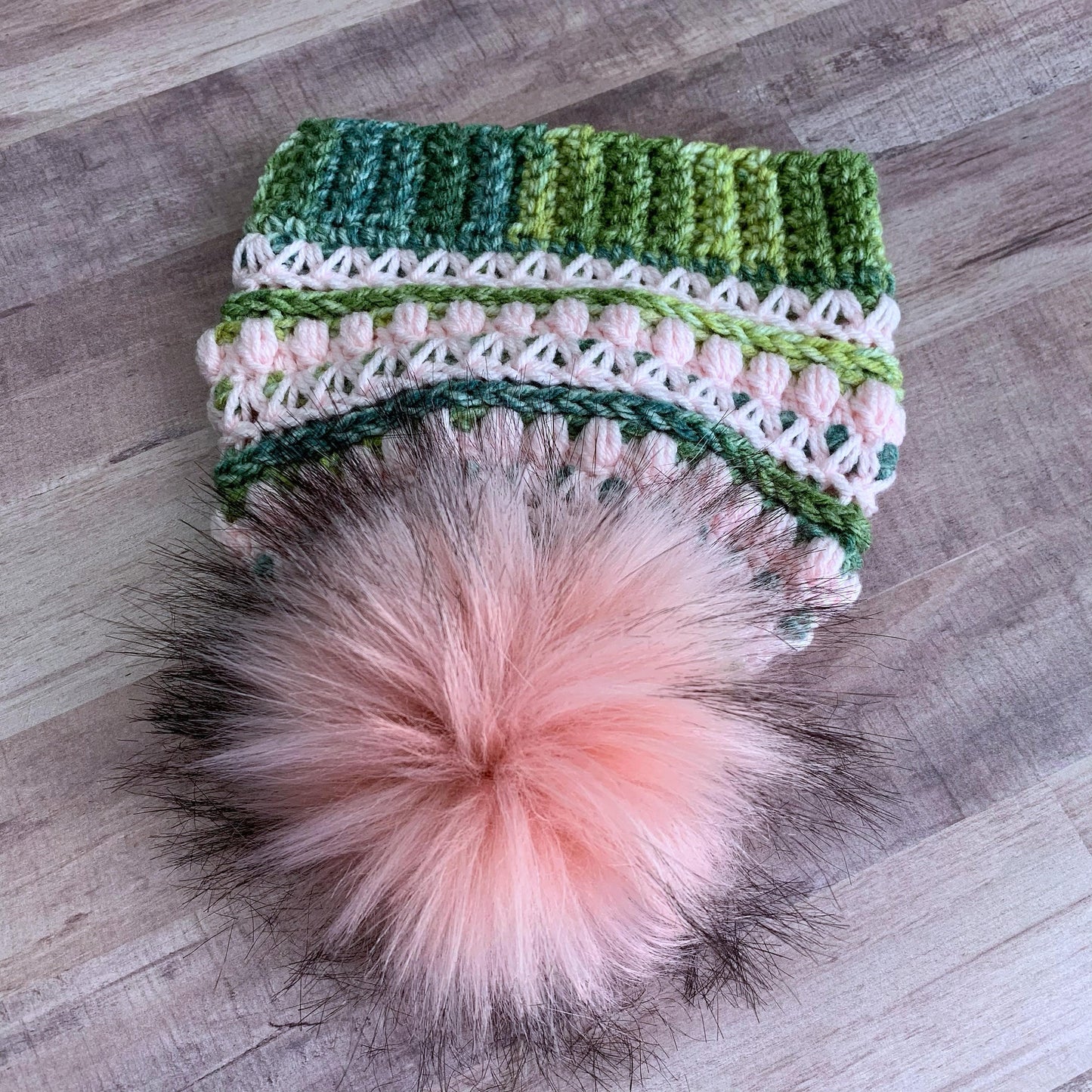 Full view of the pink faux fur pom pom