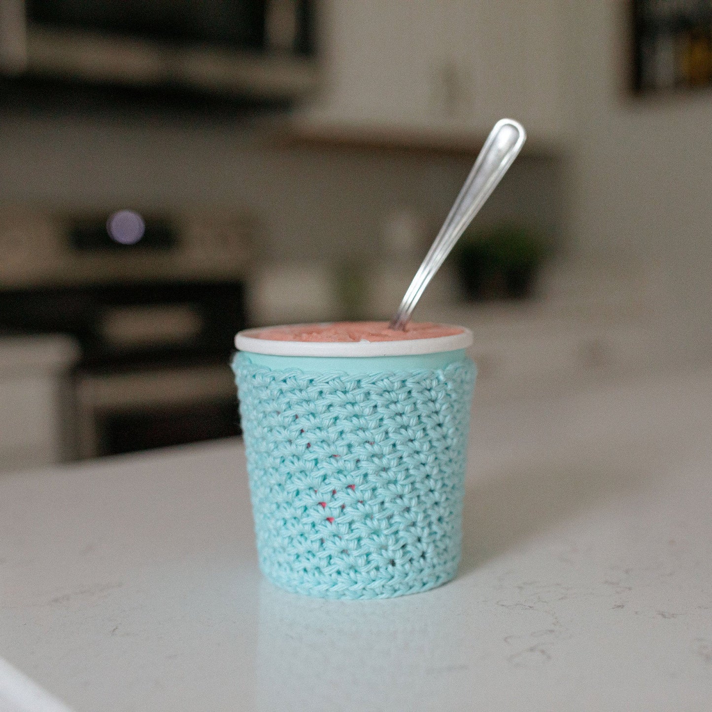 Light blue ice cream cozy sitting on kitchen counter