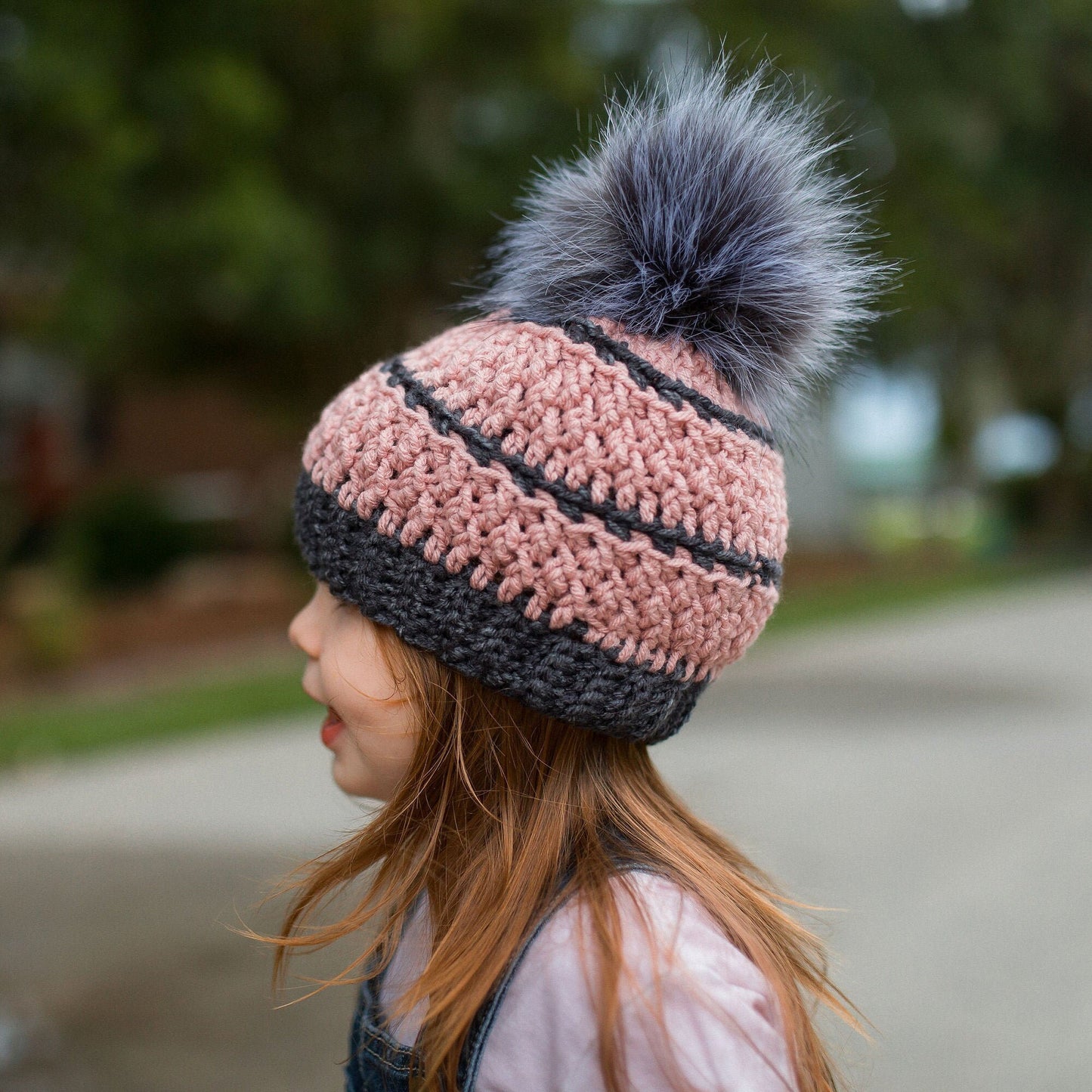 Grey and blush textured beanie with a grey faux fur pom pom