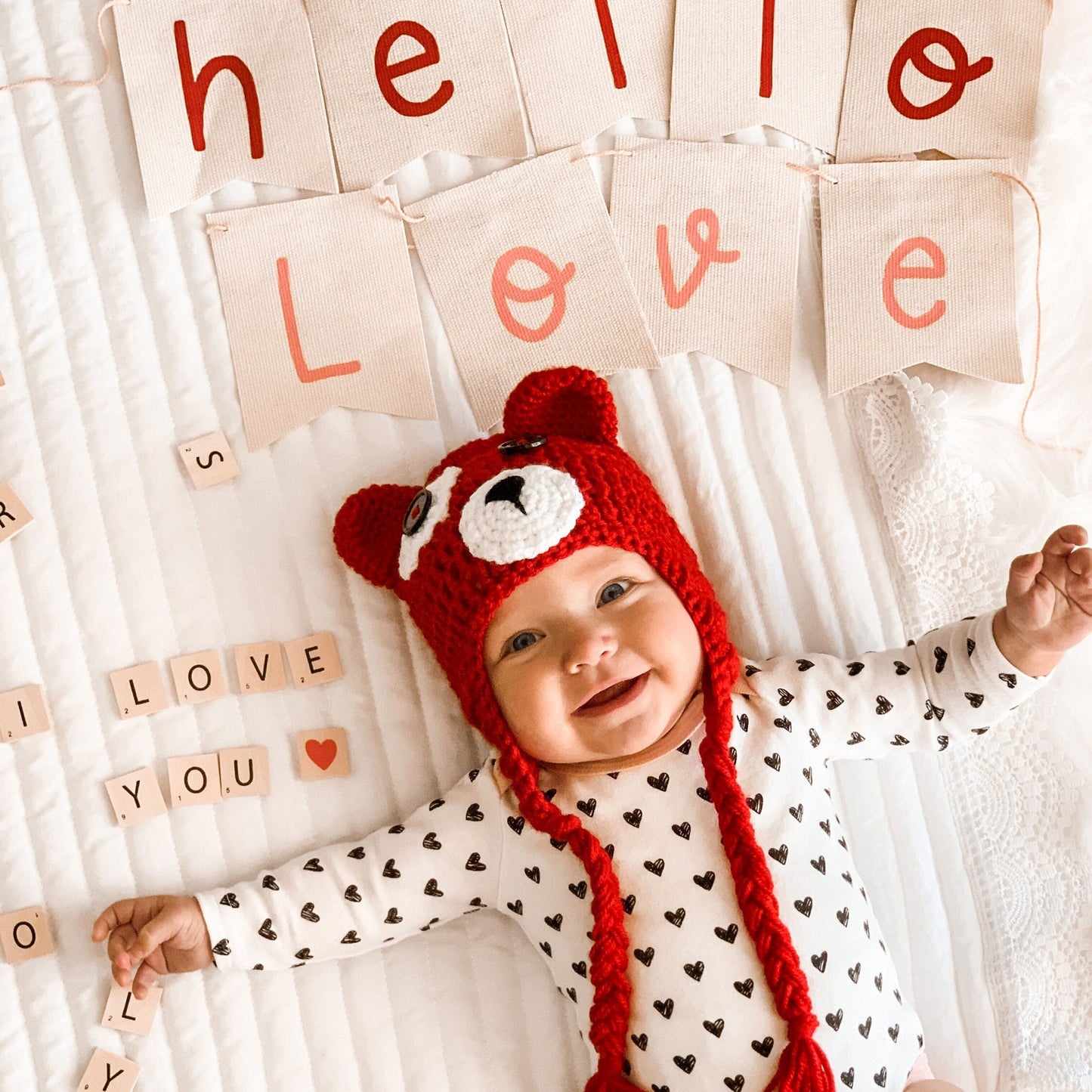 Red bear valentines day beanie on a baby.