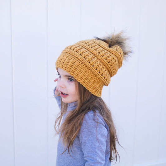 Mustard yellow beanie with brown faux fur pom pom 